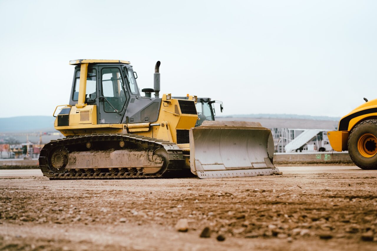 industrial building construction site mini bulldozer levelling soil